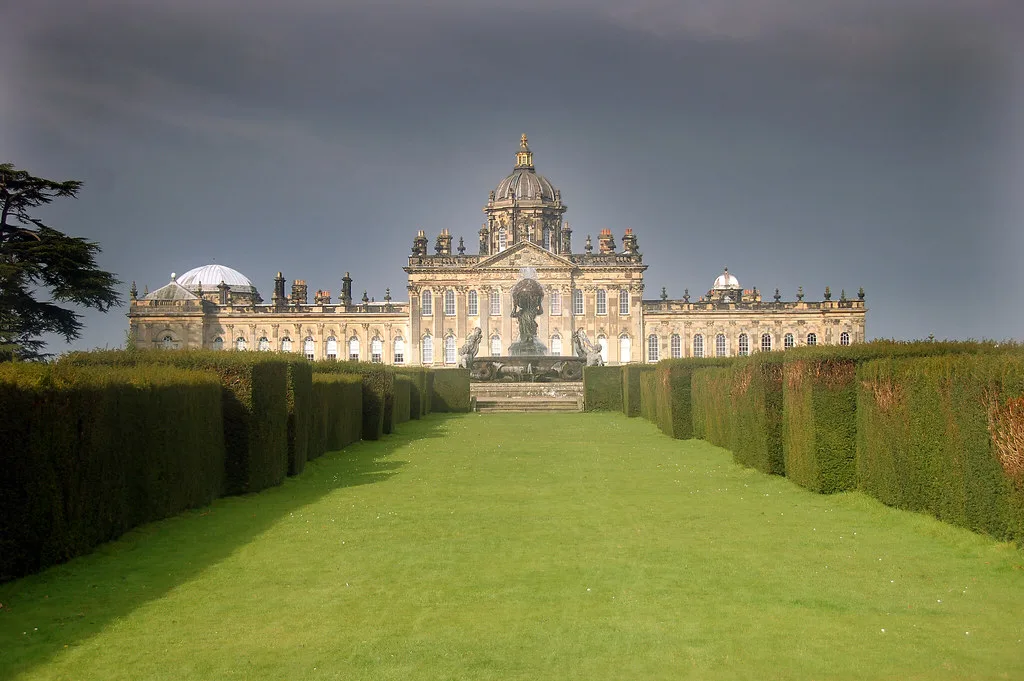 Castle Howard's south front and the Atlas Fountain, seen down the hedged lawn