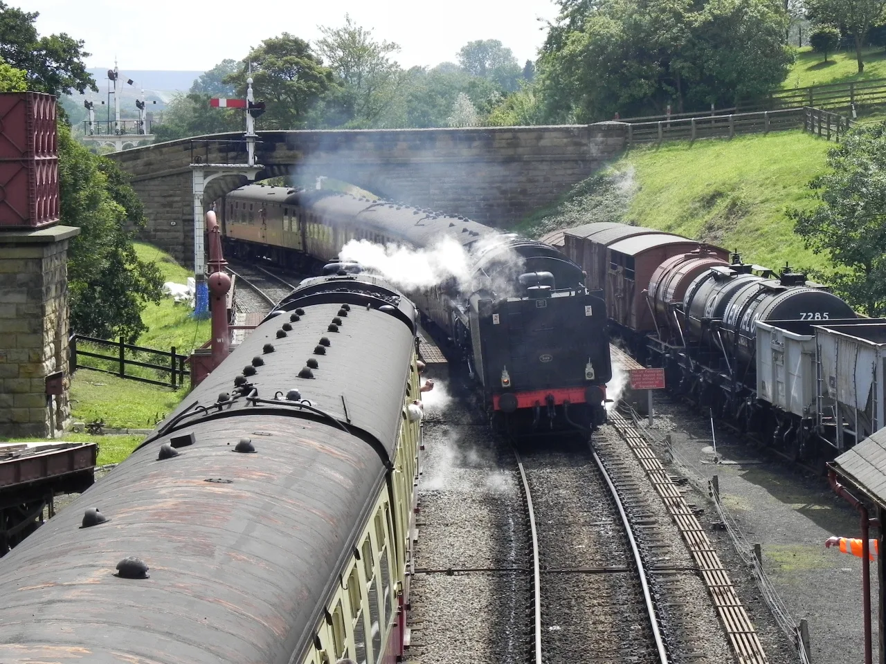 A steam locomotive and its carriages at Goathland station on the North Yorkshire Moors Railway