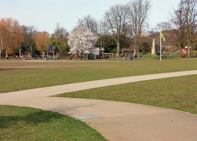 The play area at Rowntree Park, seen across the open grass of the park